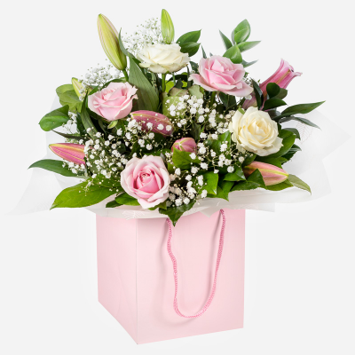 Strawberries & Cream - A beautiful collection of roses and lilies hand-tied and delivered in a gift bag or box.