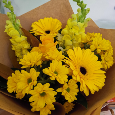 Morning Sunshine - Morning Sunshine is a radiant hand-tied bouquet that captures the essence of a sun-kissed dawn. With its vibrant yellow and golden blooms, it brings the warmth and energy of the mo