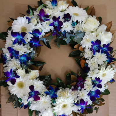 Fond Memories - Fond Memories is a serene funeral wreath, elegantly crafted in shades of blue and white.